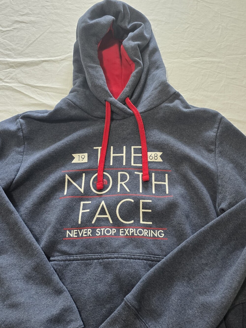 The North Face Navy Hoodie with Red Hood Lining and Drawstrings